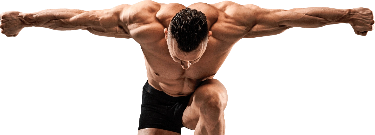 Muscular man in black shorts performs a wide-arm balance pose, torso angled forward, showcasing strength.
